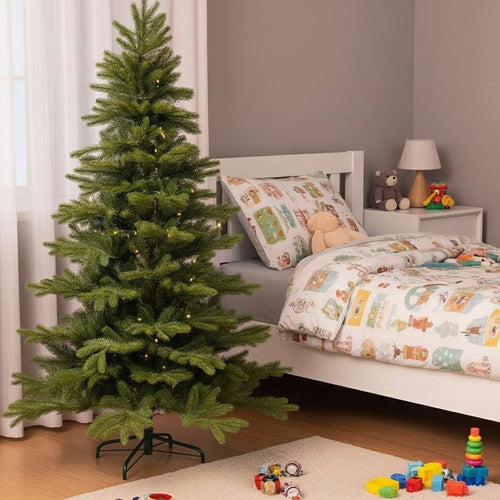 A charming artificial Christmas tree adding a festive glow to a cozy and playful child's bedroom.