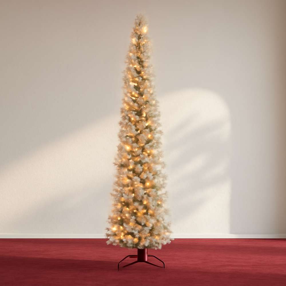 A pre-lit slim Christmas tree with golden lights, perfect for compact spaces.