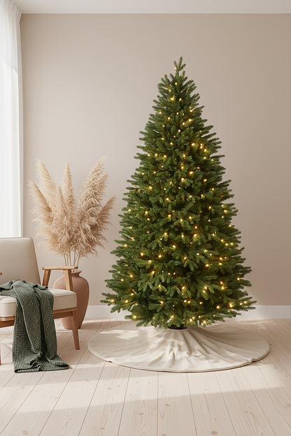 A 6ft prelit slim christmas tree with a tree skirt, shown in a modern, minimalist room.