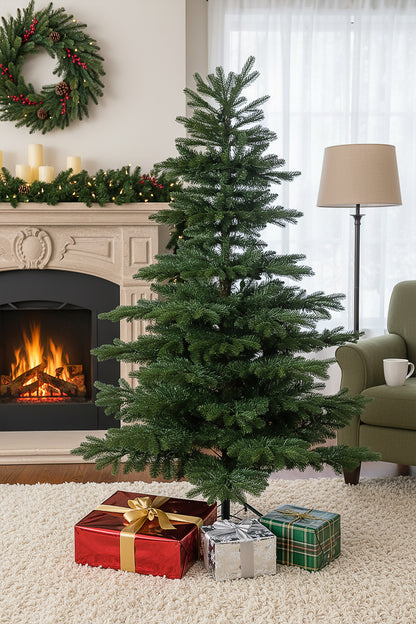 The 6ft unlit premium noble fir christmas tree shown in a living room with gifts at its base.