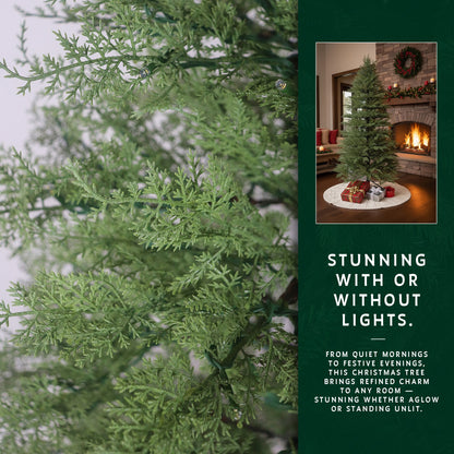 A close-up showing the detailed, realistic green foliage of the artificial cypress Christmas tree branches.