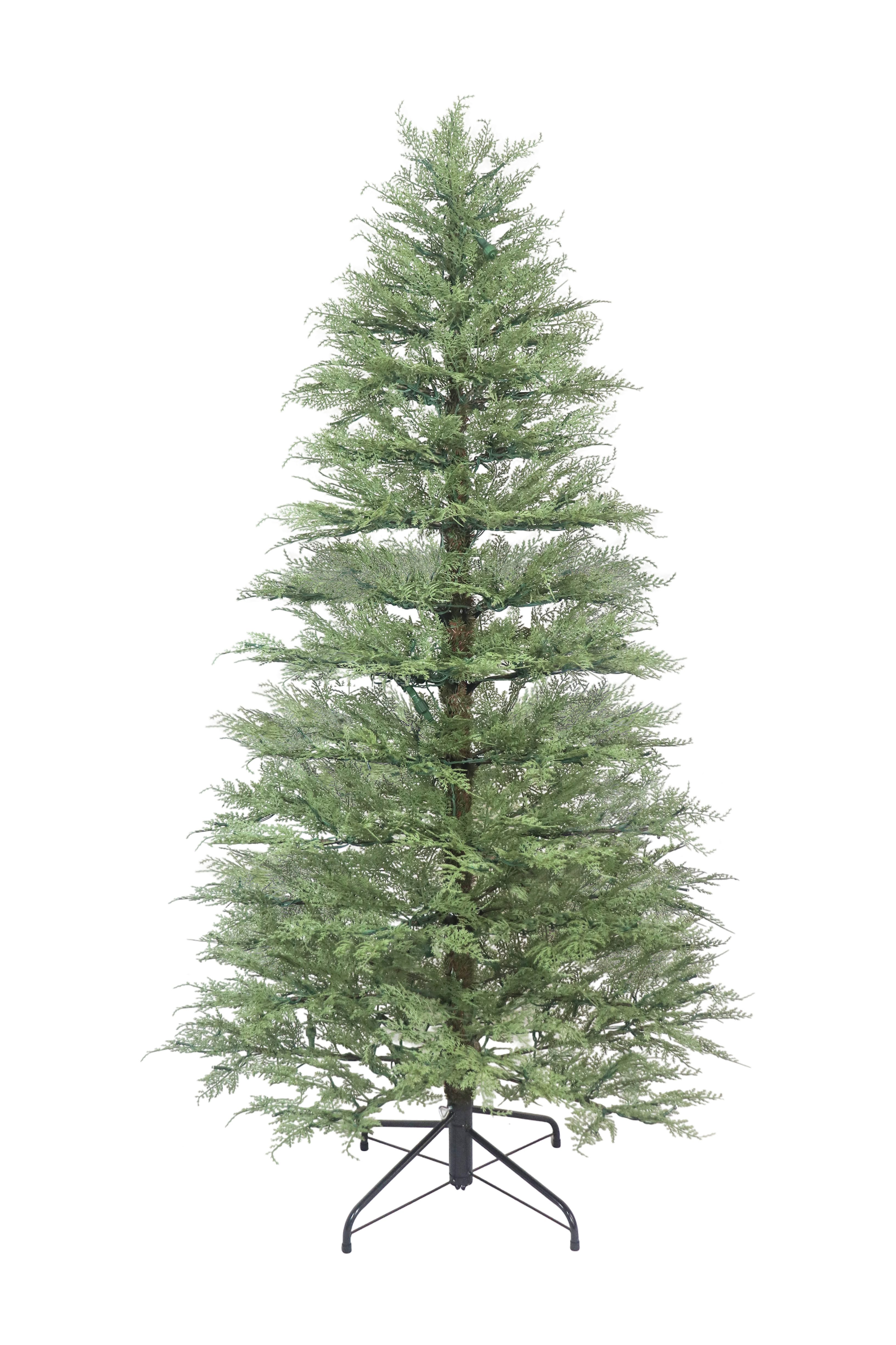 An unlit minimalist artificial cypress Christmas tree standing on its metal base against a white background.